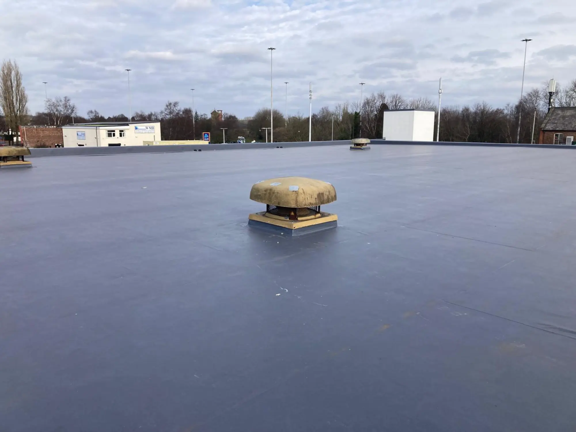 Close up of Aldi Irlams o' th' Heights' grey single ply flat roof.